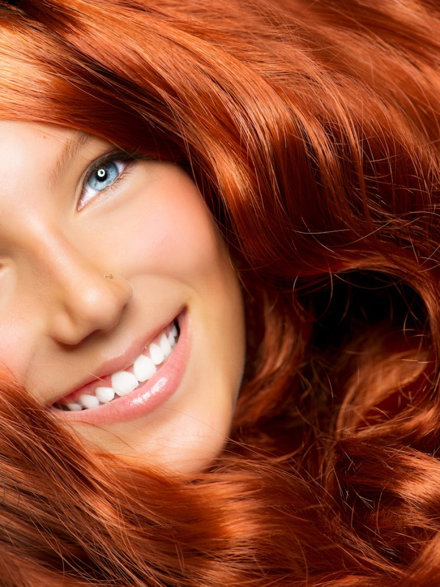 Beautiful Girl With Healthy Long Red Curly Hair